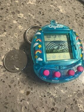 GigaPets Retro Virtual Pet Keychain in Translucent Teal with Pink Buttons